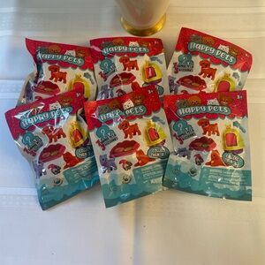 Six Unopened Packages of Happy Pet Surprise Packs